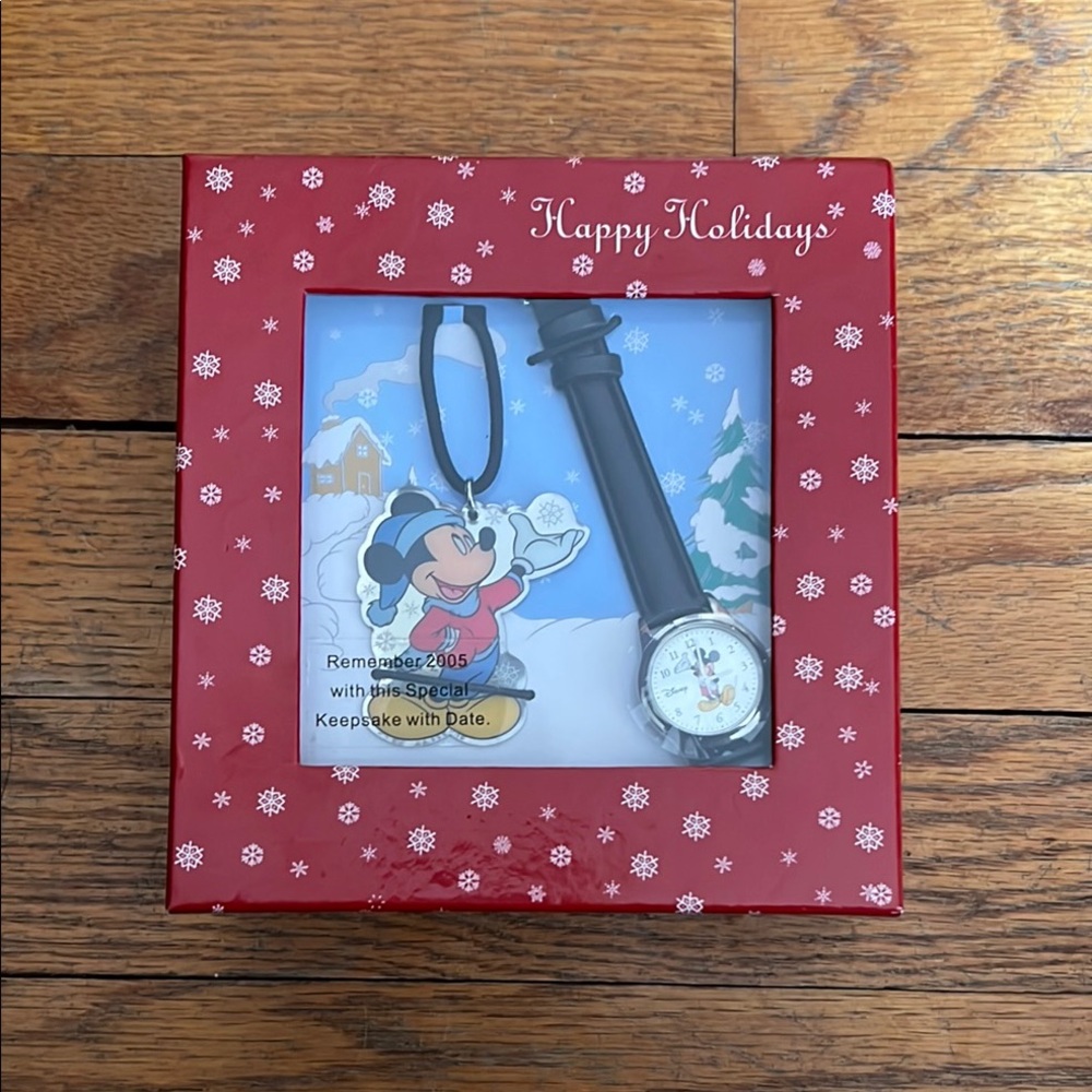 Mickey Mouse Ornament with snowflakes plus a collectible Mickey Mouse watch.
